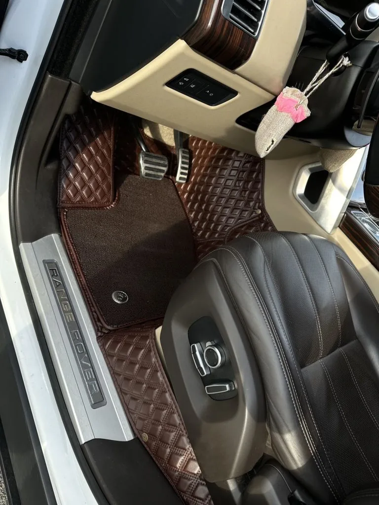 Brown quilted leather car floor mats in a Range Rover
