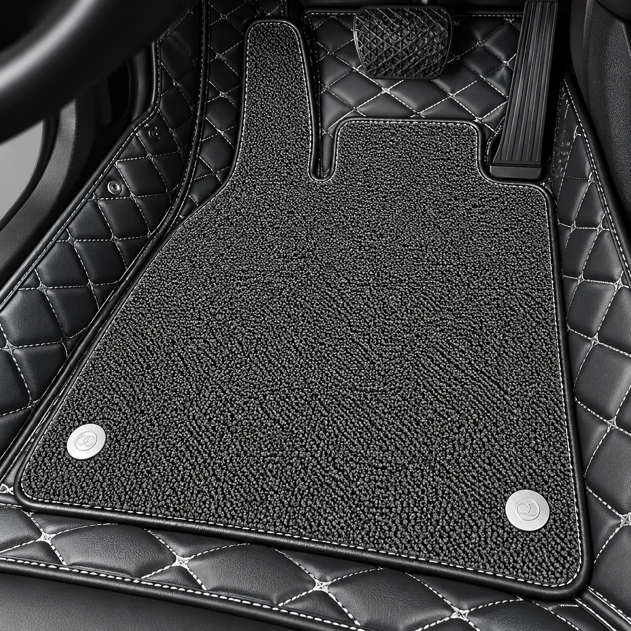 grey suede upper mat with snap buttons on black diamond quilted base, close-up