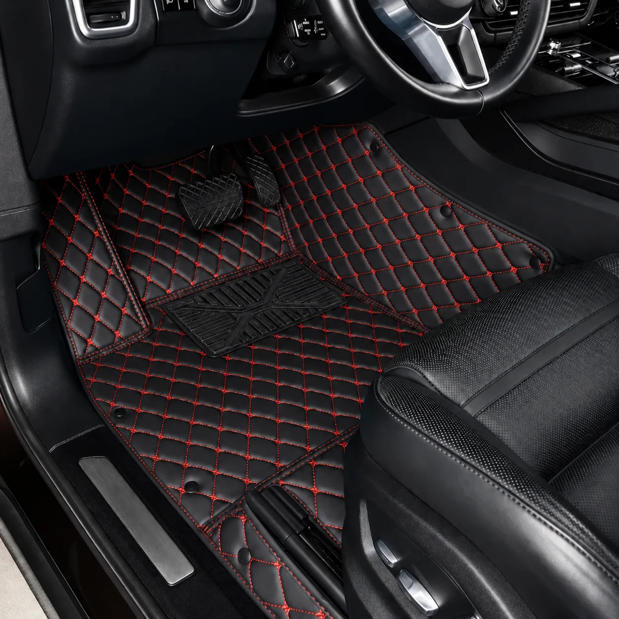 custom personalized black and red car floor mats with red stitching, driver side close-up