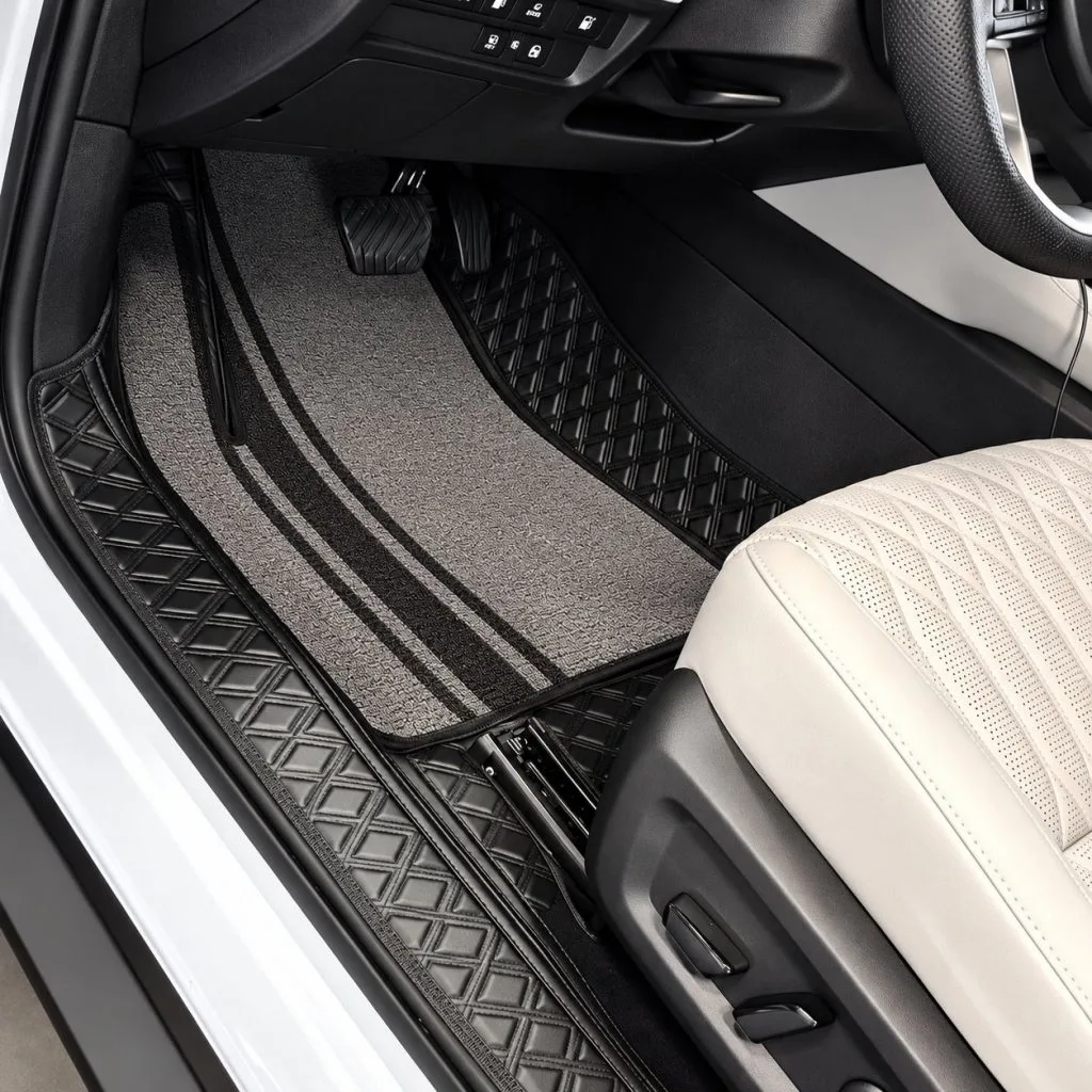 custom double layer car floor mats with grey carpet upper layer, installed in white interior car, front close-up